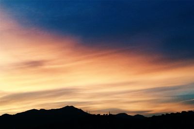 Scenic view of mountains against sky during sunset