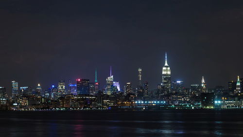 Illuminated buildings in city at night