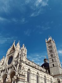 Low angle view of temple building against blue sky