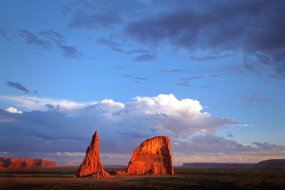 Scenic view of landscape against cloudy sky