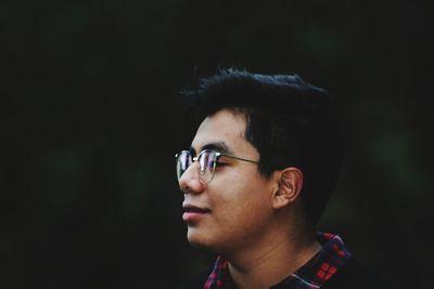 Close-up of young man wearing eyeglasses