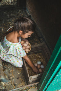 High angle view of young woman standing by plants