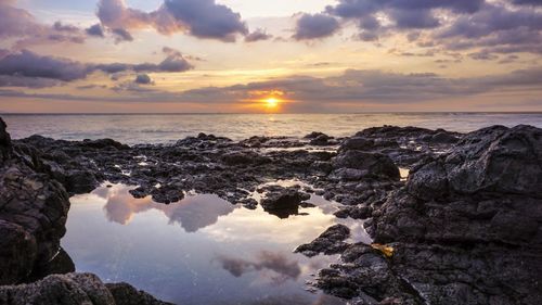 Scenic view of sea against sky during sunset