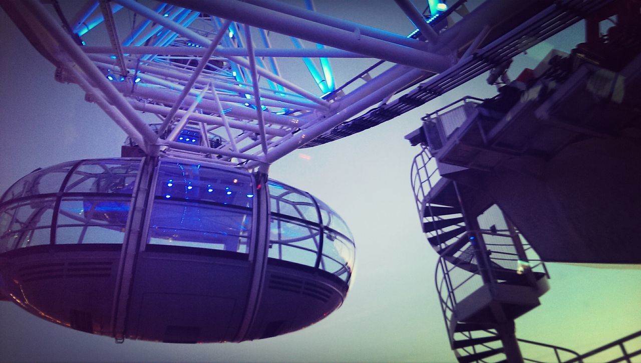 low angle view, architecture, built structure, indoors, building exterior, modern, clear sky, directly below, ceiling, building, blue, illuminated, no people, architectural feature, metal, pattern, lighting equipment, design, day, skylight