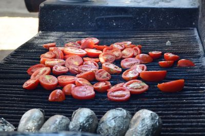 High angle view of red chili peppers on wood