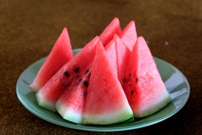 High angle view of fruits in plate on table