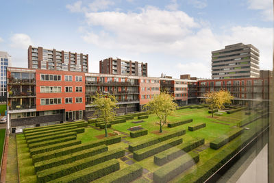 Buildings in city against sky