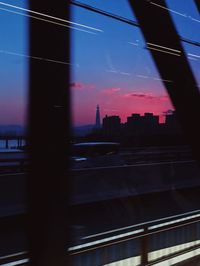Blurred motion of train in city against sky