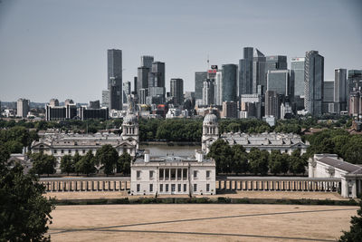 Buildings in city against sky