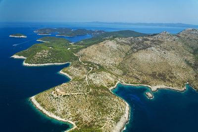 Aerial view of bay against clear blue sky