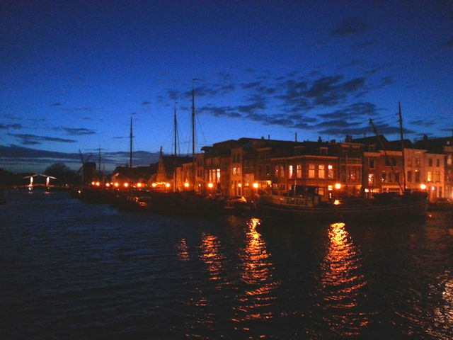 illuminated, water, transportation, nautical vessel, waterfront, building exterior, mode of transport, moored, sky, night, reflection, boat, built structure, harbor, architecture, river, street light, dusk, sunset, city