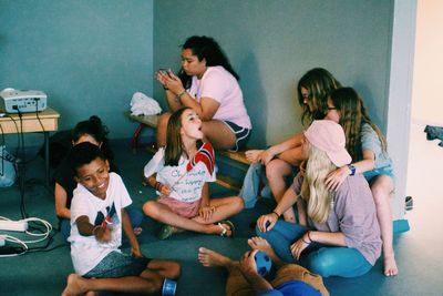 High angle view of people sitting on floor