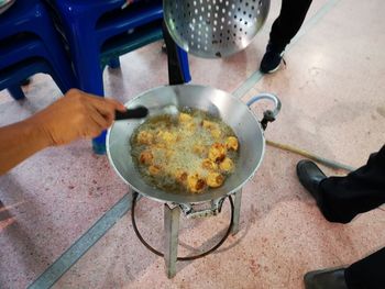 High angle view of people preparing food in kitchen