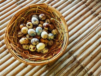 High angle view of eggs in basket on table