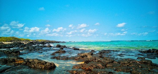 Scenic view of sea against sky volcanuc coastline