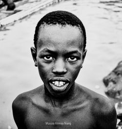 Portrait of handsome young man in swimming pool