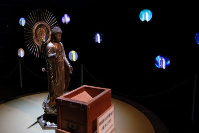 Close-up of illuminated lighting equipment on table