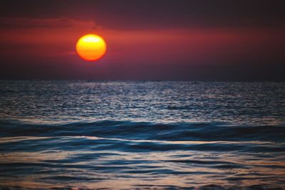View of calm sea at sunset