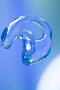 Close-up of bubbles against blue background