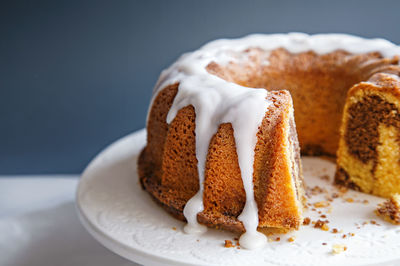 Close-up of marble cake on stand against gray background