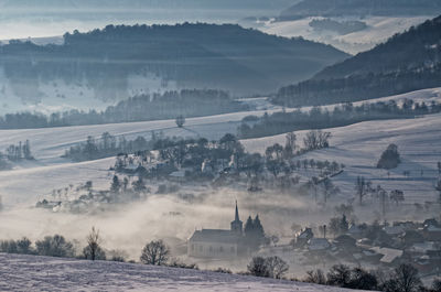 High angle view of buildings against sky during winter