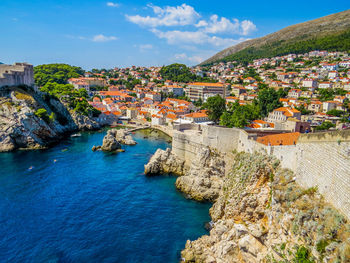 High angle view of town by sea