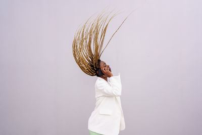 Woman standing against white background