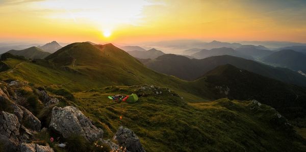 Scenic view of mountains against sky during sunrise