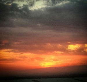 Scenic view of dramatic sky during sunset