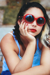 Portrait of beautiful young woman wearing sunglasses