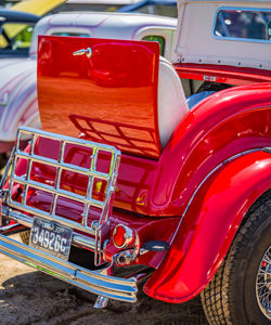 Close-up of red vintage car on road