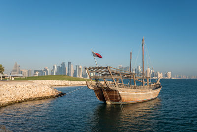 Scenic view of sea against clear blue sky, doha, qatar 