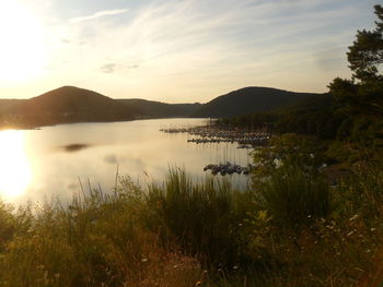 Scenic view of lake against sky during sunset