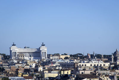 Altare della patria against clear blue sky in city