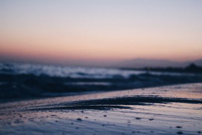 Scenic view of beach against sky during sunset