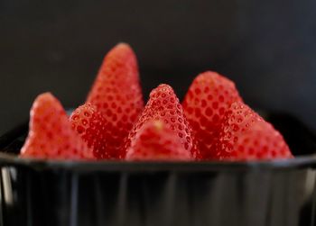 Close-up of strawberry over black background