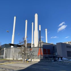 Low angle view of factory against sky