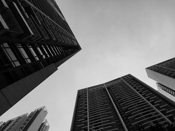 Low angle view of buildings against sky in city