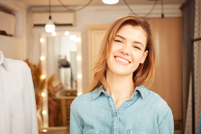 Face portrait of beautiful smiling woman with brown hair and brown eyes.