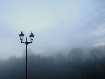 Street light against sky