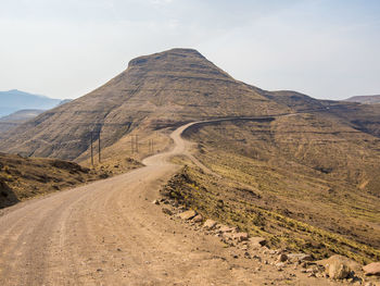 Scenic view of mountain road against sky