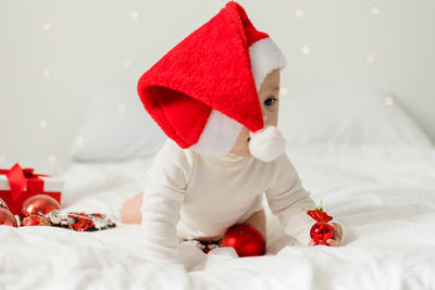 Close-up of christmas decoration on bed at home