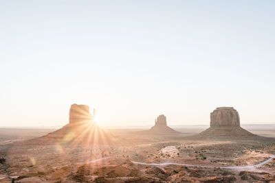 Rock formations in desert against clear sky