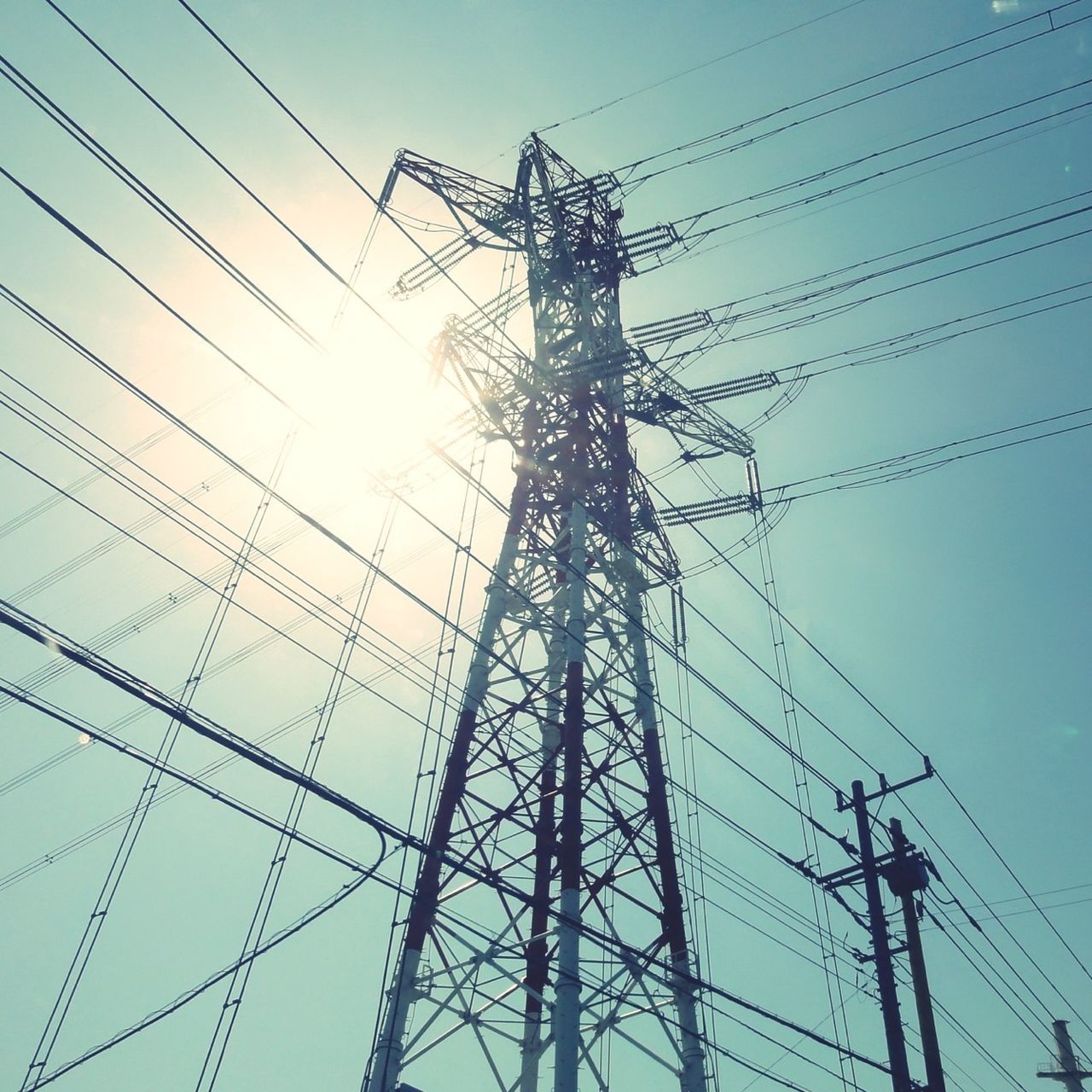 power line, electricity pylon, electricity, power supply, low angle view, cable, connection, fuel and power generation, technology, complexity, power cable, clear sky, sky, silhouette, outdoors, built structure, no people, day, wire, electricity tower
