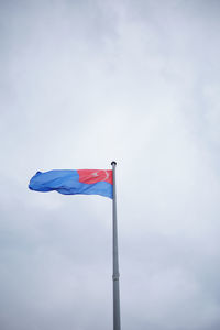 Low angle view of flag against sky
