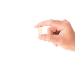 Close-up of hands against white background