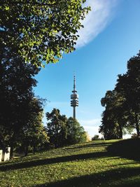 Low angle view of communications tower against sky