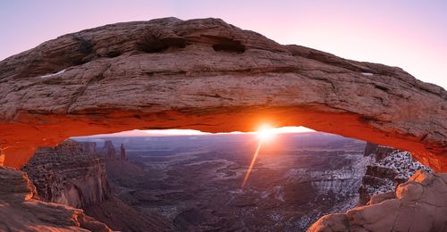 Rock formations against sky during sunset