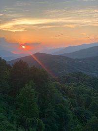 Scenic view of mountains against sky during sunset