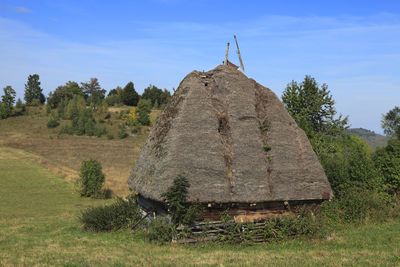 Built structure on land against sky